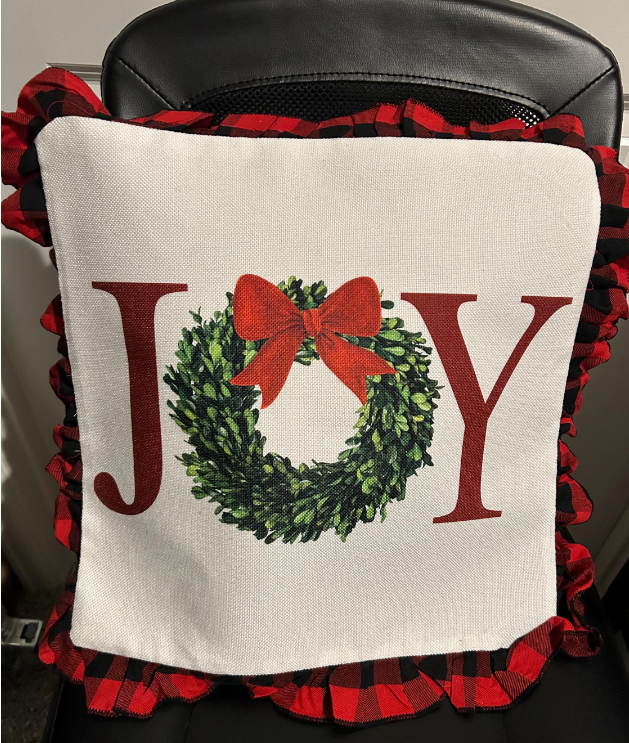 16x16 Christmas pillow with the text 'JOY' in festive colors, perfect for holiday decor."