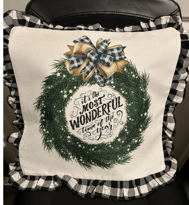 16x16 Christmas pillow with the text 'It's the most wonderful time of the year' in festive colors, perfect for holiday decor."