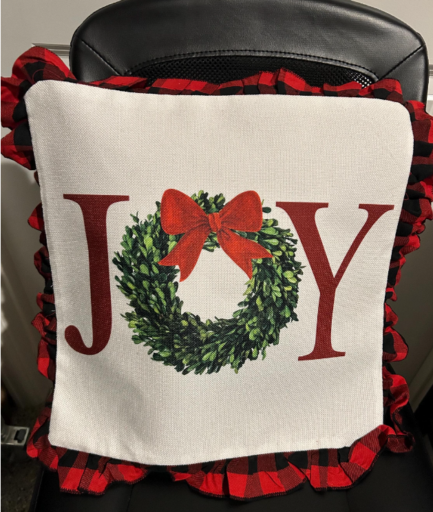 16x16 Christmas pillow with the text &#39;JOY&#39; in festive colors, perfect for holiday decor.&quot;