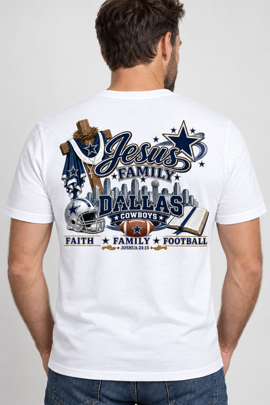 A man viewed from behind wearing a white graphic t-shirt with Dallas Cowboys football and Christian-themed designs, paired with blue jeans, against a light gray studio background.