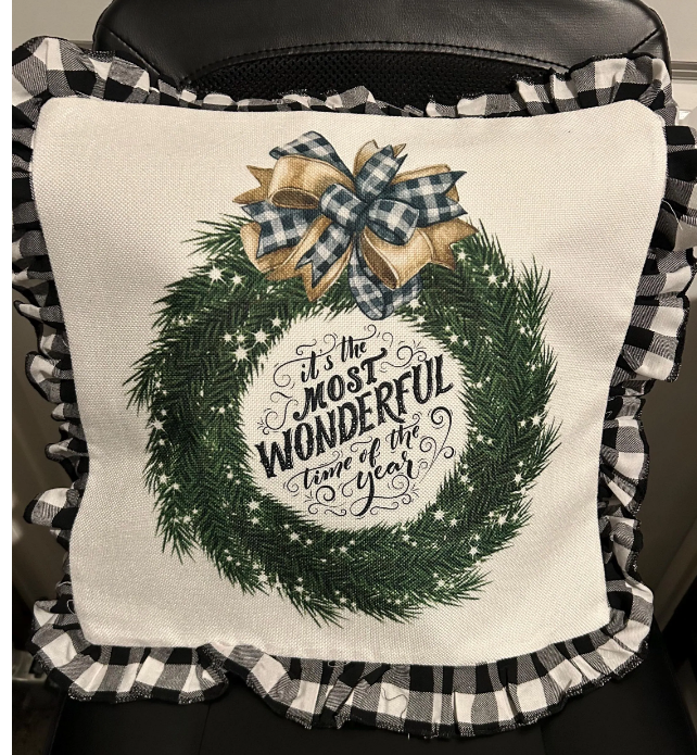 16x16 Christmas pillow with the text &#39;It&#39;s the most wonderful time of the year&#39; in festive colors, perfect for holiday decor.&quot;